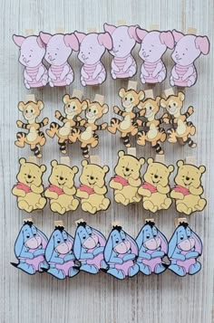 winnie the pooh and friends pin set on wooden background with clippings in different colors