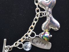 🏆 Bestseller! Tell YOUR story through charms. Each bracelet is custom made to order, personalized to your person and occasion. Unlike others, our bracelets are NOT mass produced and will not look like any other. Each bracelet comes with 10 total charms plus beads and bling to compliment your charms. (Additional charms may be added). This bracelet was made to showcase one's beloved dogs, Shayna, Leslie and Chloe. Truly a 'woman's best friends' ! 🌸Details: * 925 Sterling Silver, incredibly durab Nickel Free Charm Bracelet For Birthday Gift, Personalized Charm Bracelet For Birthday Gift, Nickel-free Charm Bracelet As Birthday Gift, Personalized Dangle Charms For Birthday, Silver Charm Bracelet With Lobster Clasp For Birthday, Personalized Silver Charm For Birthday Gift, Customized Silver Bracelets For Birthday, Customized Silver Name Bracelet For Birthday Gift, Customized Silver Name Bracelet As Birthday Gift