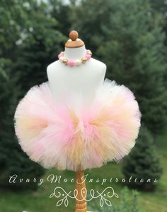 "Pink, Gold and Ivory Fluffy Girls Tutu. This girls tutu is super fluffy. I use 12 layers of tulle to make it super full and fluffy. Colors used: Pink, Gold and Ivory. TUTU SIZES: (measure waist to make sure) Preemie-12\" waist 4.0\" Length Newborn-13\" waist 4\"Length 3-6 mos-14-17\" waist 5\" length 6-12 mos-18-19\" waist 7\" length 18-24 mos-20-21\" waist 7\" length 2T/3T- 21-22\" waist 7\" length 4-5 girls-22-23\" waist 8\" length 6-8 girls-23-24\" waist 8\"length 8-10 girls- 24-25\" waist 9 High Chair Tutu, Infant Tutu, First Birthday Tutu, Measure Waist, Birthday Highchair, Newborn Photo Shoot, Toddler Tutu, Rainbow Tutu