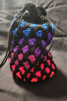 This is a handmade crochet dicebag. I used this stitch to mimic the look of a jewel encrusted adventure's bag. It is lined with black felt. Drawstring and clasp pull for a tight closure, tipped with metal aglets. This bag is about 9x6 inches when flat. I've sold most of these for use as dice bags and some for protection for Tarot decks so far. I use one to keep all of my toiletries in. You know, whatever works!  Thank you for stopping by! And please allow for some mild color variance from photog Handmade Black Pouch For Everyday Use, Everyday Handmade Black Pouch, Handmade Black Crochet Bag As A Gift, Handmade Black Crochet Bag As Gift, Handmade Black Crochet Bag For Gift, Black Handmade Crochet Bag For Gift, Handmade Black Crochet Pouch Bag, Handmade Black Pouch As Gift, Black Crochet Bags As Gift