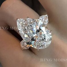 "Three stone moissanite pear shaped engagement ring,celebrity style,unique heart&13 CT huge large pear 3 stone moissanite gold wedding ring → Occasions: Engagement & Wedding DESCRIPTION -------------------- STYLE :Three stone *Moissanite Details →Main Stone :Pear →Size (mm) :20*13 →Carat weight :13 →Band & Halo & Side Stone :heart →Size (mm) :5*5 →Carat Weight :0.9 →Stone Total CTW :13.9 → Color : Colorless →Clarity :VVS →Metal :SOLID (10K/14K/18K )GOLD →Band Width :2.5 mm * Purchasing Option: → Pear-shaped Moissanite Wedding Rings With Vvs Clarity, Wedding Diamond Ring With Vs Clarity In Teardrop Shape, Diamond White Pear-shaped Wedding Ring, Diamond White Pear-shaped Diamond Cut Jewelry, Pear-shaped Vvs Clarity White Wedding Ring, White Pear-shaped Vvs Clarity Wedding Ring, Pear-shaped Moissanite Ring With Vvs Clarity, Pear-shaped Moissanite Rings For Formal Occasions, Vvs Clarity Diamond Pear-shaped Wedding Ring