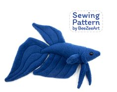 an image of a blue fish with the sewing pattern on it's back side