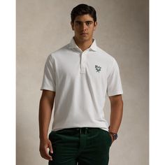 An American style standard since 1972 the Polo shirt has been imitated but never matched. Over the decades Ralph Lauren has reimagined his signature style in a wide array of colors and fits yet all retain the quality and attention to detail of the iconic original. This version is made with our highly breathable cotton mesh which offers a textured look and a soft feel and finished with a crossed tennis racket crest at the chest. Classic White Relaxed Fit Polo Shirt, Ralph Lauren Cotton Polo Collar Top, Ralph Lauren White Polo Shirt, White Ralph Lauren Polo Collar Shirt, Ralph Lauren Cotton Polo Top, Classic Ralph Lauren Short Sleeve Shirt, Classic Collared Ralph Lauren T-shirt, Classic Ralph Lauren Tops With Spread Collar, Classic Ralph Lauren Collared T-shirt