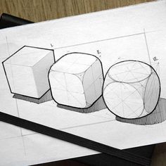 three cubes are shown on top of a piece of paper, and one is drawn in pencil