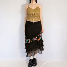 Mesh floral embroidered skirt Stunning brown mesh midi skirt with colourful embroidered flowers on the front. Has a diagonal 3 tiered ruffled hem. Fully lined, has an elastic waistband. Made in the early 2000s by iCe.  Perfect condition  Full measurements are provided Measurements taken flat Tag size: 8 (medium) Waist: 30" - 34" Hip: 40" Length: longest point: 36", shortest point: 29.5" Fabric content: Nylon exterior, polyester lining Midi Skirt Y2k, Mesh Midi Skirt, Skirt Y2k, Embroidered Skirt, Y2k Vintage, Embroidered Flowers, Midi Skirt, Womens Skirt, Mesh