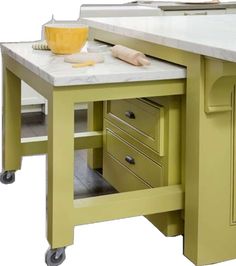 a kitchen island with two drawers on each side and an open drawer at the top