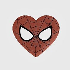 a heart shaped spiderman mask with eyes drawn on the front and back of it