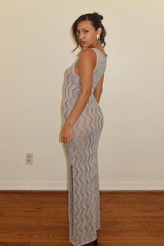 Sparkle and shine in our Silver Metallic Crochet Knit Dress! This stunning formal dress also doubles as a stylish cover-up. Its shiny, beautiful design will make you stand out and feel confident at any event. Make a statement with this must-have dress! Model is wearing a size small Chic Knit Midi Dress For Party, Elegant Party Crochet Dress, Knit Fitted Midi Dress For Party, Sleeveless Knit Party Dress, Fitted Knit Maxi Dress For Party, Fitted Knit Midi Dress For Party, Elegant Crochet Knit Maxi Dress, Elegant Stretch Knit Maxi Dress, Stretch Knit Maxi Dress For Party