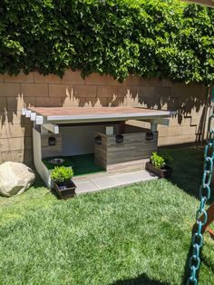 a small dog house in the back yard