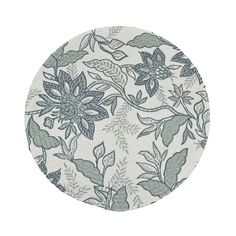 a white plate with green leaves and flowers on it