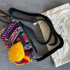 Great Condition Crossbody Camera Bag, Includes Everything You Want, Handcrafted, Embroidery, And Many Interior Pockets!!! It’s Double Zip With Two Compartments, Interior Zip Pocket, Interior Dividing Pocket. Secret Back Pocket Pom-Pom Charm. All Leather Strap Adjustable Woven Interior Design. Includes Dust Bag Never Worn Perfect Condition. Can Be Worn As A Clutch Detachable Straps Chic Multicolor Embroidered Bag, Pom Pom Charm, Crossbody Camera Bag, Camera Bag, Leather Straps, Zip Pockets, Dust Bag, Pom Pom, Black Pink