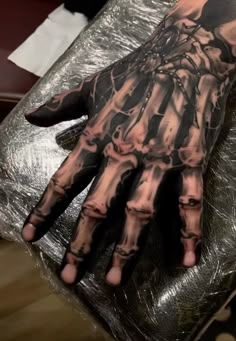 a man's hand covered in black and white ink