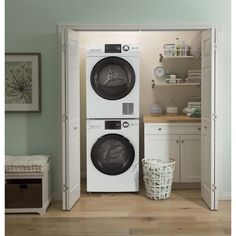 a washer and dryer sitting in a room next to each other with the door open