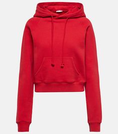 Timmi cropped cotton-blend jersey hoodie in red - The Row | Mytheresa Cropped Winter Sweater With Drawstring Hood, Sporty Hooded Cropped Sweater With Drawstring, Sporty Cropped Hooded Sweater With Drawstring, Winter Athleisure Cropped Sweater With Drawstring Hood, Winter Cropped Sweater With Drawstring Hood, Sporty Cotton Cropped Sweater With Ribbed Cuffs, Trendy Cropped Hoodie With Drawstring, Red Cotton Hoodie For Fall, Casual Cropped Hooded Sweater With Drawstring