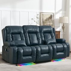 a blue reclining couch with rainbow lights on the armrests in a living room