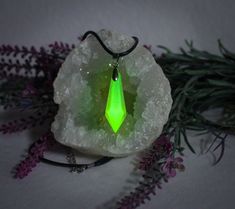 GREEN DROP CRYSTAL Glow in the Dark and Black Light Lamp / Luminous Necklace with Pendant for Unisex / Party Jewelry and Cosplay ❤️ Handmade item ❤️ GLOW IN THE DARK ❤️rechargeable with black light ❤️WITH chain ❤️ easy to wear ❤️ own ideas ❤️ Artist name / own brand ❤️ Quality checked ❤️ Exceptional jewelry ❤️ Shipping from Germany ❤️ Fast shipping to Germany ❤️ Each product is unique and one of a kind Our unique neon green glowing crystal necklace is a fascinating piece of jewelry for young adu Glowing Crystal Necklace, Luminous Necklace, Glowing Crystal, Necklace With Pendant, Stylish Necklace, Party Jewelry, Light Lamp, Jewelry Party, Black Light