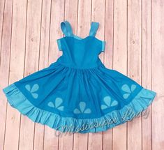 This is a little girl's Poppy troll inspired dress that is perfect for troll movie lovers. It is fun to wear because your child can twirl like a princess.  Flowers that trim the dress are embroidery stitched appliques that give its one of a kind look. Dress ties in the back.    It is made out of cotton fabric. Machine wash with like colors.   Made to order from a smoke free home.  Please message me with any questions prior to ordering. Princess Style Fitted Twirl Dress For Dress-up, Fitted Fun Costume Dress, Fun Fitted Costume Dress, Whimsical Summer Princess Dress For Fancy Dress, Whimsical Princess Dress For Summer Fancy Dress, Princess Dress With Ruffles For Play, Playful Ruffled Dress For Costume Party, Princess Style Dress With Ruffles For Play, Whimsical Fitted Princess Dress With Ruffles