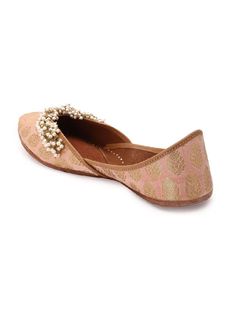 A Pair of light Peach juttis in Brocade zari bootis with pearl embellishments, perfect to go with all your outfits. Select from our simple and elegant jutti Collection to pair with your festive and wedding Outfits. Double Cushioning for Extra Comfort. Color: Peach Fabric: Upper: Brocade Insole - Leatherette Sole - Vegetable tanned Leather Sole Note: Available in other colors The product will be shipped within 20-25 days of the order placed Any slight irregularities are distinctive and are inhere Diwali Reception Flats, Peach Traditional Wear With Gota Work, Festive Zari Work Flats For Reception, Wedding Flats With Zari Work For Diwali, Festive Flats With Zari Work For Reception, Festive Wedding Flats With Zari Work, Elegant Flats With Dori Work For Reception, Dori Work Flats For Wedding And Diwali, Bollywood Wedding Flats With Meenakari