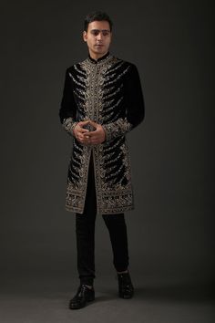 Black silk velvet sherwani with silk lining and resham embroidery in floral and paisley motifs.
Component: 1
Pattern: Embroidered
Type Of Work: Resham
Neckline: Mandarin
Sleeve Type: Full
Fabric: Silk Velvet, Lining: Silk
Color: Black
Other Details: 
Resham work
Note: Pant worn by the model is not for sale
Occasion: Groom,Wedding - Aza Fashions Traditional Velvet Sherwani For Wedding, Festive Velvet Sherwani For Wedding, Traditional Velvet Sherwani With Zari Work, Ceremonial Velvet Traditional Wear With Resham Embroidery, Velvet Traditional Wear With Resham Embroidery For Ceremonial Occasions, Traditional Velvet Sherwani For Festive Season, Ceremonial Black Sherwani With Dupatta, Luxury Black Sherwani With Zari Work, Traditional Formal Velvet Traditional Wear