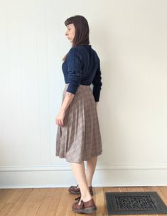 "Vintage Pleated Plaid Skirt  era: 1970s Polyester Wool Acrylic blend  Made in Canada by Paris Star Tag reads \"14\" Below the Knee Length Cut High Waisted Elastic Waist Band Good Vintage Condition. The pleats are no longer crisp and the waistband is starting to lose stretchiness, still cute and wearable. MEASUREMENTS Waist 28\" to 32\" Hips 60\" (full) Length 27\" MODEL MEASUREMENTS: HEIGHT 5' 4\" BUST 34\" WAIST 28\" HIPS 36\" Combine multiple items to save on shipping!  Be sure to check out our shop policies!" Vintage Full Pleated Skirt For Fall, Vintage Fall Pleated Skirt, Vintage Pleated Skirt For Fall, Vintage Fall Skirt, Vintage Flared Skirt Bottoms For Fall, Vintage Pleated Flared Skirt, Vintage Midi Skirt Bottoms For Fall, Vintage Flared Skirt For Fall, Vintage Midi Skirt For Fall