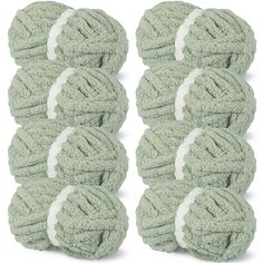 six balls of green yarn with white trims on each end and one ball in the middle