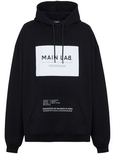 black cotton blend logo patch to the front front pouch pocket drawstring hood long sleeves ribbed cuffs and hem Streetwear Tshirt Design, Lab Logo, Balmain Men, Black Hoodie Men, New Paris, Streetwear Tshirt, Black Men Fashion, Mens Activewear, Black Hoodie