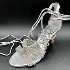 Vince Camuto Women's Aimery Wrap Around Ankle Dress Sandal Heeled, Clear/Silver Never Worn (New Without Box) Product Details About This Item Sole Material Leather Outer Material Suede Closure Type Lace Up Water Resistance Level Not Water Resistant Country Of Origin Vietnam About This Item Suede Material Sandal - Heeled Laces Closure Description Sparkle With Every Step In The Aimery Dress Sandal. Ropes Of Rhinestones Decorate Your Toes While Leather Laces Criss Cross Up Your Foot And Wrap Around Ankle Dress, Vince Camuto Shoes, Suede Material, Dress Sandals, Leather And Lace, Wrap Around, Vince Camuto, Criss Cross, Shoes Women Heels