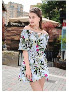 This lovely off-the-shoulder sundress is sassy but sweet. Featuring a an off-the shoulder top with a small front cut-out, a cinched waist with a sash bow belt and a flowing skirt falling mid-thigh. This dress pairs perfectly with wedges, heels, sandals or booties. Made with a polyester blend and comes in three fabulous floral color patterns from which to choose. Cute Off-shoulder Summer Dresses, Bohemian Off Shoulder Dress For Spring Vacation, Bohemian Off-shoulder Dress For Spring Vacation, Bohemian Off-shoulder Dress For Summer, Bohemian Off Shoulder Dress For Summer Vacation, Summer Off-shoulder Dress, Casual Cold Shoulder Beach Dress, White Off Shoulder Summer Dress For Vacation, Chic Off-shoulder Mini Dress For Summer