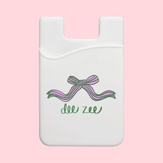 a white case with a pink ribbon on the front and green lettering that says del zer