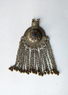 Gorgeous antique Bedouin tribal pendant with bells, Kuchi Afghan or Yemen Hand Crafted necklace, pendant. Measures 19.5 x 10cm (7.7 x 3.9 inches). Probably dates from the second half of 1800's. Please check the last photo for condition. Items are shipped in the next 3 business days after receiving payment. We ship by Hellenic Post and after shipping we provide a tracking number. Shipping time depends on the destination and usually it takes approximately:  To USA-CANADA  1-2 weeks  To Europe 4-7 Traditional Dangle Jewelry With Large Pendant, Traditional Jewelry With Large Dangle Pendant, Traditional Bronze Necklaces For Festivals, Traditional Bronze Necklace For Festivals, Traditional Antique Gold Metal Necklace, Traditional Necklace With Large Dangle Pendant, Traditional Bronze Necklaces For Rituals, Traditional Bronze Pendant Necklace, Heavy Bohemian Pendant Necklace