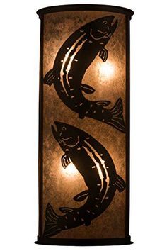 two fish are lit up on the wall