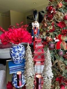 a christmas tree decorated with red, white and blue ornaments