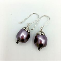 16mm Baroque Swarovski Crystal Pearls With Stainless Steel Bead Caps And Hook Earwires. Beautiful Mauve Color. Measures 1-1/2” Handcrafted By Czechthatbead! Silver Pearl Earrings With Round Beads, Silver Round Bead Pearl Earrings, Beaded Sterling Silver Pearl Earrings, Silver Beaded Sterling Silver Pearl Earrings, Silver Round Bead Pearl Earrings As Gift, Silver Beaded Teardrop Pearl Earrings, Silver Beaded Round Pearl Earrings, Silver Teardrop Beaded Pearl Earrings, Silver Beaded Pearl Earrings