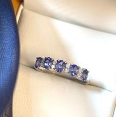 Tanzanite and diamond eternity ring Tanzanite And Diamond Ring, Gold Eternity Ring, Eternity Ring Gold, Tanzanite Diamond Ring, Diamond Eternity Ring, Tanzanite Stone, Tanzanite Diamond, Claw Setting, Tanzanite Ring