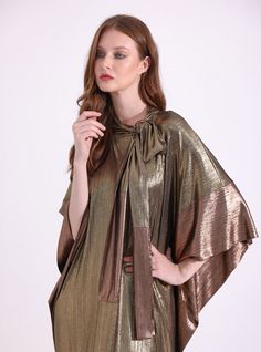 WF ATELIERMat Mat gold relax fit evening out kaftan Fabric: 100% Polyester The model wears size One size and is 177 cm tall. Garment length: 145 cm Festive Gold V-neck Kaftan, Gold Maxi Length Kaftan For Festive Occasions, Gold Maxi-length Kaftan For Festive Occasions, Festive Gold Maxi Length Kaftan, Festive Gold Tunic Dress, Elegant Festive Cape Kaftan, Gold Dress With Cape Sleeves For Party, Gold Party Dress With Cape Sleeves, Gold Silk Kaftan For Festive Season