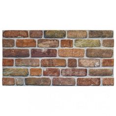 a brick wall made out of different colored bricks