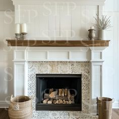 a fire place with logs in the middle and two candles on each shelf above it