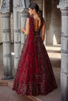 Editor's Note Burgundy Tulle Lehenga Choli With Belt And Dupatta With Tonal Applique Work Embellished With Sequins, Metallics, Beads, And Crystals Color: Burgundy Fabric: Tulle Care: Dry Clean ... Burgundy Lengha Bridal, Burgundy Lehenga Simple, Burgundy Wedding Lehenga, Burgundy Lehenga Bridal, Burgundy Lehenga, Tulle Lehenga, Maroon Lehenga, Designing Clothes, Maroon Fabric