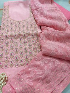 Item Overview ATHARVA Hand Embroidered Salwar Kameez w/Embroidered Neck in Pink/Full Embroidered Georgette Dupatta/Custom Stitching/Wedding/Bridal/ Dno. CH1451 Fabric: * Shirt Chanderi Silk 2.5 Mts, Pink- Embroidered Neck * Dupatta: Georgette Embroidered Dupatta-Hot Pink 2.5 Mts * Bottom Santoon Silk 2.5 Mts. Excusive Hand Embroidered Party Wear Punjabi Suit. Customization: * Fabrics Customization: Designs Can be made in different Fabrics. * Color Customization: Designs Can be made in different Multicolor Embroidered Anarkali Set For Wedding, Embroidered Sets For Wedding And Diwali, Embroidered Dola Silk Sets For Wedding, Pink Chanderi Dress With Intricate Embroidery, Georgette Kurta With Intricate Embroidery For Traditional Ceremonies, Wedding Sets In Dola Silk With Embroidery, Wedding Sets With Embroidery In Dola Silk, Pink Sets With Intricate Embroidery For Traditional Ceremonies, Elegant Multicolor Embroidered Salwar Kameez For Wedding