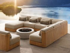 a large sectional couch sitting next to a fire pit