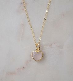 Looking for a unique accessory for some self love, or love for that special someone? Crafted from 14k gold filled and natural Rose Quartz, this pendant is the perfect, sparkling way to show anyone how much you care. Rose Quartz is a stone of love. It is believed to restore trust & harmony in relationships and encourage unconditional love. It purifies the heart and promotes self love, inner healing, and friendship. It is an alternate birthstone for January, as well as the spiritual birthstone for Feminine Round Pendant Jewelry Gift, Rose Gold Heart Pendant Necklace Gift For Her, Rose Gold Heart Pendant Necklace For Her, Rose Gold Heart Jewelry For Valentine's Day, Minimalist Rose Gold Heart Cut Jewelry, Feminine Pendant Jewelry Gift, Pink Heart Gemstone Necklace For Gift, Pink Gemstone Heart Necklace Gift, Pink Gemstone Heart Necklace For Gift