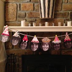 a fireplace decorated with birthday hats and candles for the man's face on it