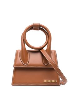 Le Chiquito Noeud shoulder bag from Jacquemus featuring brown, calf leather, gold-tone logo plaque, foldover top with magnetic fastening, single shoulder strap and internal slip pocket. This item is in size UNI and the color is Brown Jacquemus Le Chiquito, Jacquemus Bag, Leather Cap, Handbag Backpack, Tote Handbags, Canvas Tote, Womens Shoes Sneakers, Mini Bag, Top Handle