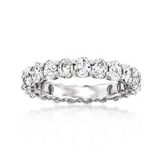 a white gold wedding band with round cut diamonds