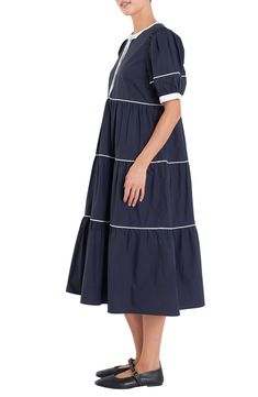 Contrast piping accentuates the tiered skirts and puff sleeves of this breezy cotton midi dress. Hidden-button half placket Band collar Short sleeves Lined 100% cotton Hand wash, dry flat Imported Cotton Midi Dress With Ruffle Hem, Elegant Tiered Cotton Midi Dress, Cotton Midi Dress With Ruffle Hem And Short Sleeves, Chic Cotton Tiered Midi Dress, Tiered Cotton Midi Dress With Ruffle Hem, Cotton Midi Tiered Dress With Ruffle Hem, Modest Mouse, English Factory, Tiered Skirts