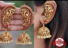 Matte Finish Temple Gold Earring Hanging Pearl Long Jhumkas Set South Indian Kemp Earring Designer Jhumkas Cuff Earring  Color :    White / Matte Golden   Gemstone :   Pearl / Kemp Stones Product Type :  Earring Set / Jhumka Product Details : Our Jewelry is handcrafted by traditional artisans. Each piece is individually double checked for quality purposes.  Ideal Gift Idea: Perfect beautiful & memorable gift for you and your loving wife, girlfriend, sister, aunt, daughter and mom/mother/mummy. T Pearl Jhumkas, Temple Jewellery Earrings, Traditional Light, Gold Jhumka Earrings, Ear Chain, Cuff Earring, South Indian Jewelry, Jewelry Mirror, Bollywood Jewelry