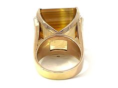 Item Specifications:Metal: 14k Yellow GoldRing Size: 7Ring Weight: 23.0 gramsGemstone Specifications:Gemstone: Yellow TopazTopaz Measurements: 20.14 mm x 17.03 mm x 14.34Topaz Carat Weight: ~43.50 CaratsColor: Yellow BrownShape: RectangleCut: Emerald Step CutTransparency: TransparentDiamond Count: 12 single cut diamondsDiamond Weight: 0.35 caratsDiamond Color: I-JDiamond Clarity: VS2-SI1Condition: Preowned, Excellent Please see all photos for details, feel free to ask all questions before biddin Modern Yellow Gold Topaz Ring With Polished Finish, Modern Topaz Ring With Center Stone In Yellow Gold, Modern Yellow Gold Topaz Ring With Center Stone, Modern Citrine Rings For Formal Occasions, Modern Formal Gemstones With Polished Finish, Formal Yellow Gold Topaz Ring With Polished Finish, Luxury Hallmarked Topaz Ring For Formal Occasions, Formal Citrine Gemstones With Center Stone, Modern Formal Hallmarked Topaz Ring