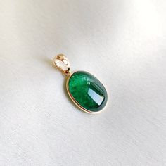 This stunning pendant is set in 14k Solid Yellow Gold with Natural Emerald with utmost precision. It is an unique gemstone pendant for nearly every occasion and is completely hassle-free jewelry. ITEM DETAILS: * Gem: Emerald * Gem Size: 11x15mm * Gem Shape: Oval * Gem Weight: 7.22 carats * Gold Purity: 14KT * Gold Weight: 0.57 gram * Total Weight of the Pendant: 2.01 gram The Gold purity is guaranteed and it comes with authentic 14KT gold hallmark. Since my items are handmade, they are absolutel Oval 14k Gold Gemstones As Gift, 14k Gold Pendant Gemstone Fine Jewelry, 14k Gold Pendant Gemstones In Fine Jewelry Style, 14k Gold Fine Jewelry Pendant Gemstone, Oval 14k Gold Gemstones For Gift, May Birthstone Pendant Gemstone, May Birthstone Pendant Fine Jewelry, May Birthstone Pendant Gemstone Fine Jewelry, Classic May Birthstone Gemstones For Gift