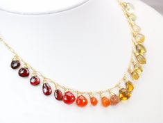 THE JEWELRY IS SHIPPED via DHL EXPRESS (2-5 days delivery door to door). THE DHL SHIPPING COST IS INCLUDED IN THE PRICE. The Sunset Necklace - Solid Gold 14K Multi Gemstone Orange Red Drop Necklace, Semi Precious Colorful Necklace ► Measurements / Details: - Necklace Length: Made to Order - Gold: High quality Gold Filled - Silver: High quality Sterling Silver ► Gemstones: The necklace includes excellent AAA quality precious gemstones: ~ Scapolite ~ Lemon Quartz ~ Citrine in several shades ~ Hone Cheap Multicolor Natural Stones Necklaces, Cheap Multicolor Gemstone Beaded Crystal Necklaces, Cheap Multicolor Necklaces With Natural Stones, Luxury Multicolor Beaded Necklace For Festive Season, Gold Multi-stone Drop Gemstones, Red Briolette Gemstone Beads Necklace, Amber Drop Gemstone Necklace, Multicolor Drop Gemstone Necklaces, Red Multi-stone Necklaces As Gifts