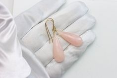 Soft Pink Peruvian Opal earrings. Faceted cut teardrop. High quality French ear wires - either 14k solid yellow gold or 14k gold filled or sterling silver available - you choose. Gemstone size is 10x28mm, 18 carats. The mannequin shows the relative size and how they will hang. Earrings hang 1.8 inches. Opals are naturally lightweight to wear for larger earrings. Please check out my store for more gemstone earrings, bracelets and necklaces. Peruvian Opal, Opal Earrings, Large Earrings, Pink Opal, Soft Pink, Gemstone Earrings, Gold Filled, Solid Gold, Opal